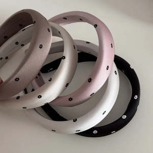 Minimalist satin sponge headband set with small floral patterns in various neutral colors