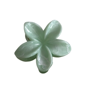 Translucent light green marble plumeria hair claw clip with sweet floral design