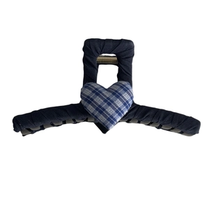 Navy blue fabric hair claw clip featuring a 3D heart-shaped blue and white checkered pattern