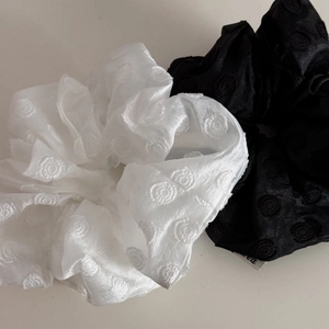 Set of two elegant black and white scrunchies with pearl embroidery and jacquard texture
