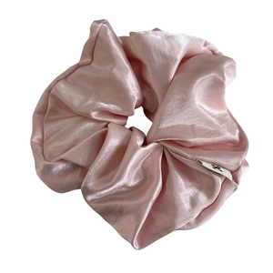 Elegant cream pink satin oversized scrunchie with minimalist logo tag for hair styling