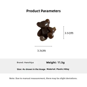 Detail view of a cute dark brown bear hair clip showing 3.3x3.5cm dimensions and weight