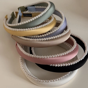 Elegant satin padded headband with pearls set in various soft pastel colors