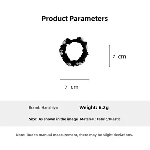 Black fabric scrunchie with white pearls measuring 7cm diameter and weighing 6.2g