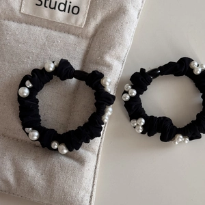 Set of two black ice silk hair scrunchies with elegant pearls for stylish ponytails