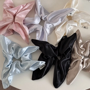 Glossy satin oversized scrunchie in cream, pink and pastel colors for elegant ponytails
