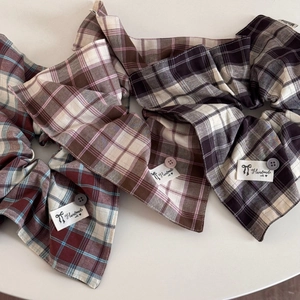 British style plaid scrunchies with buttons and handmade tags on white background
