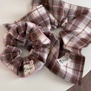 Close-up of handmade plaid scrunchie and headscarf set with button detail