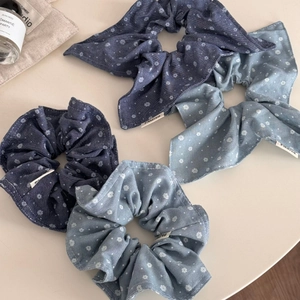 Floral denim style scrunchies set in dark and light blue with delicate white patterns