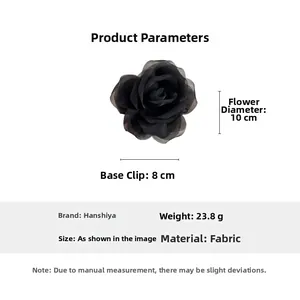 Detail view of the black fabric rose hair claw clip showing 10cm flower size and 8cm clip