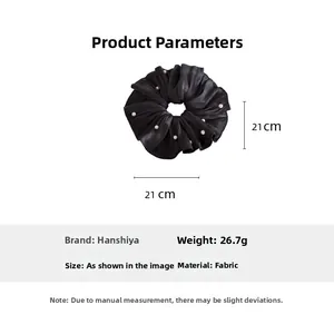 Detail of a large black beaded chiffon scrunchie with 21cm diameter measurement