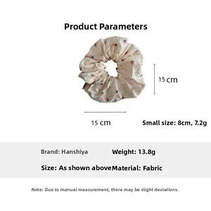 Detailed size chart for strawberry print scrunchie showing 15cm and 8cm fabric dimensions