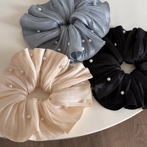 Three elegant pleated chiffon hair scrunchies with faux pearls in beige, blue, and black