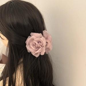 Elegant mauve gauze rose flower hair claw clip for bun hairstyles on dark hair