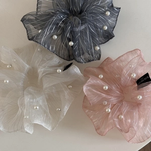 Three oversized mesh hair scrunchies with pearls and glitter yarn in grey, white, and pink
