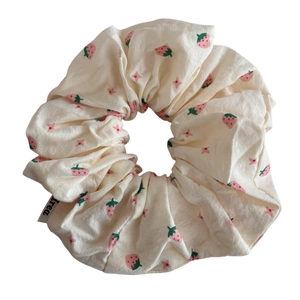 Sweet strawberry print scrunchie in cream fabric with star pattern for girls' hair