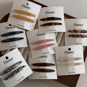 French minimalist acetate hair clips in assorted colors and patterns on cards