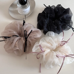 Elegant tulle organza scrunchies with long ribbon bows in black, champagne, and ivory colors