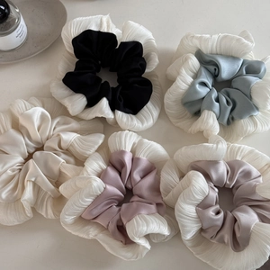 Elegant satin pleated scrunchies set in neutral colors for versatile hair styling