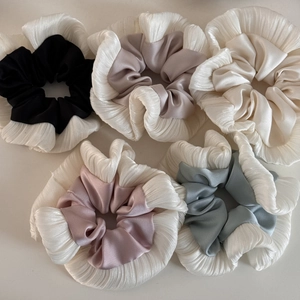 Set of five pleated satin hair scrunchies in champagne, pink, blue, black, and ivory