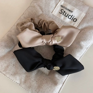 Elegant satin bow hair ties with gold metal charms in beige and black set of two