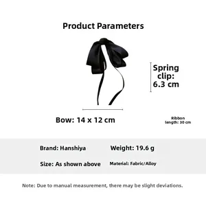 Detail view of black satin bow hair clip with 30cm long ribbons and 6.3cm spring clip