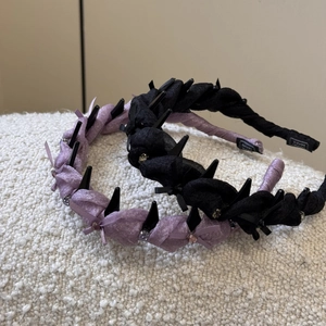 Sparkling rhinestone bow headband with punk rivets in purple and black colors