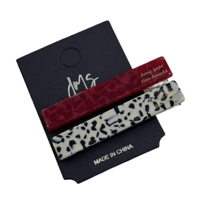Pair of rectangular acetate hair clips in tortoise shell and leopard spot patterns