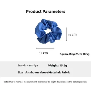 Detail view of Klein blue fabric scrunchie showing 15cm diameter size and texture