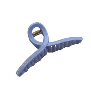 Minimalist light blue hair claw clip with twisted glossy design for women's hair styling