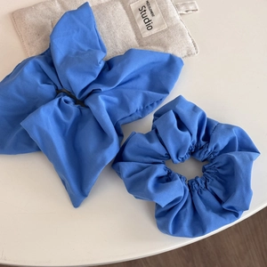 Macro detail of Klein blue scrunchie set showing premium textured cotton fabric
