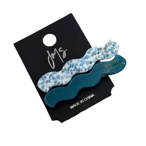 Elegant wavy acetate hair clips in blue terrazzo and dark cyan set on display card