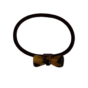 Elastic hair tie with a classic tortoise shell pattern acetate bow in retro brown style