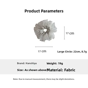 Detail showing white lace scrunchie with 17cm diameter and lightweight fabric texture