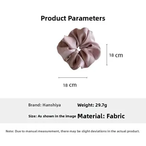 Details des rosa Stoff-Haargummis mit 18cm Maßen und leichtem Gewicht von 29,7g