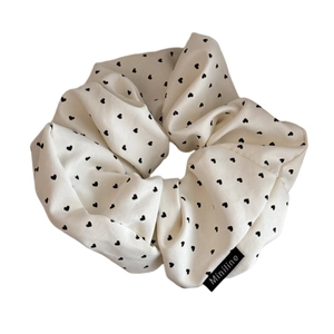 Creamy white heart polka dot oversized scrunchie with brand tag and elastic fabric
