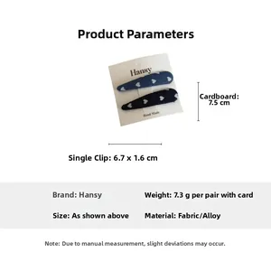Detailed view of navy denim heart hair clips with dimensions 6.7cm by 1.6cm