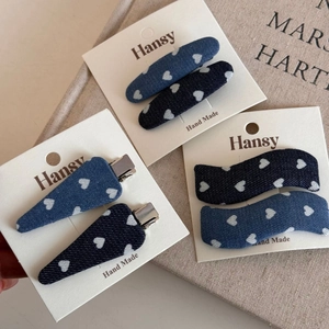 Blue denim hair clips set with heart pattern and diverse shapes on display card