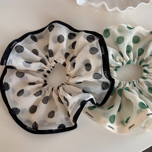 Elegant chiffon polka dot scrunchies with black and green accents and ribbon detail
