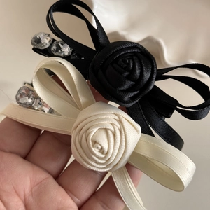 Elegant rose ribbon bow hair clip set with rhinestones in black and cream satin