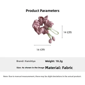Detail view of pink tulip fabric scrunchie showing 14cm dimensions and lightweight material