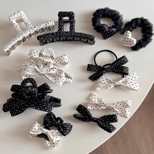 French style hair accessories set featuring black and white polka dot bows and clips