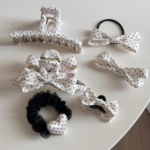 Detailed set of 6 black and white polka dot hair accessories including clips and ties