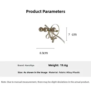 Detail showing dimensions of 8.5x7cm for this elegant pearl bow hair clip with tassels