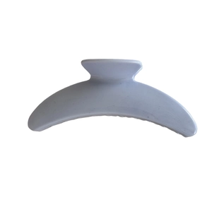 Minimalist light blue hair claw clip with crescent arc shape on a plain white background