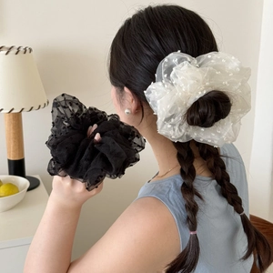 Elegant polka dot organza scrunchies in black and white with a sheer textured finish