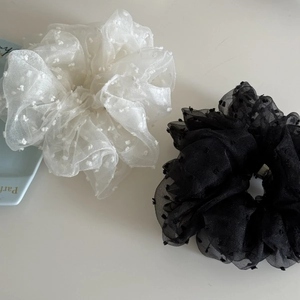 Detail of white and black large organza scrunchies with 3D dot embroidery and mesh texture