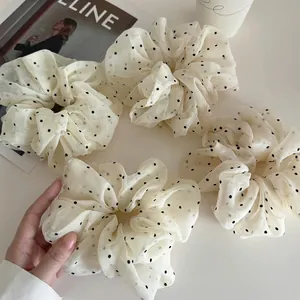 Set of four cream polka dot sheer mesh scrunchies with elegant translucent organza fabric
