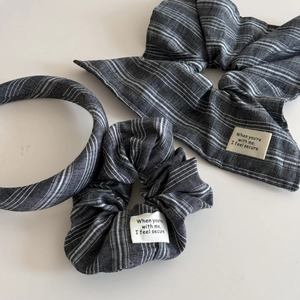 Detail of grey pinstripe hair accessories set including bow scrunchie and headband