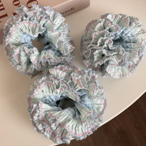 Three-piece gingham scrunchie set in light blue and white with pink ruffled edges